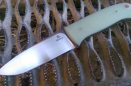 Bushcraft knife in the style of Lars Falt, made in RWL34 and natural G10