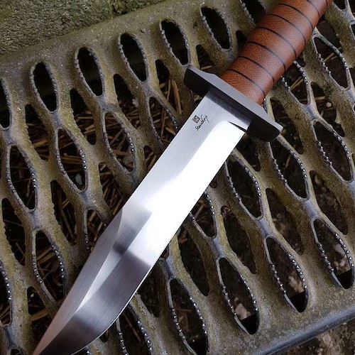 'ultimate' KaBar. This has a blade of CPM-3V, 416 guard and a stacked micarta handle.