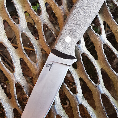 A tough blade designed with bushcraft and survival applications in mind.