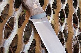 Edge-quenched 8670 carbon steel is acid washed and extremely tough, as are the linen micarta scales.